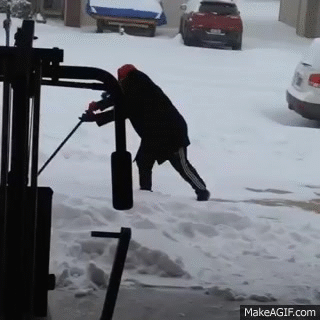 Ridiculous Slip While Shoveling Snow on Make a GIF