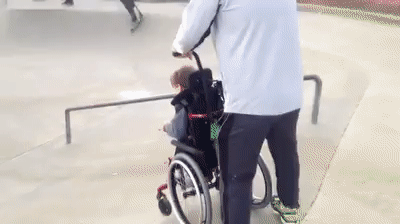 Dad helps boy in wheelchair shred some ramps on Make a GIF