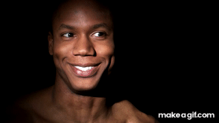 Man laughing on a black background. on Make a GIF