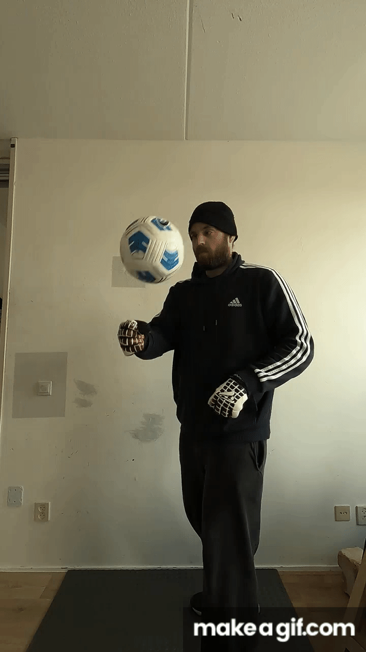 Keeper, holding the ball up with the fists on Make a GIF