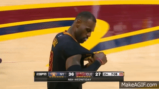 LeBron James rips the sleeves off of his sleeved jersey