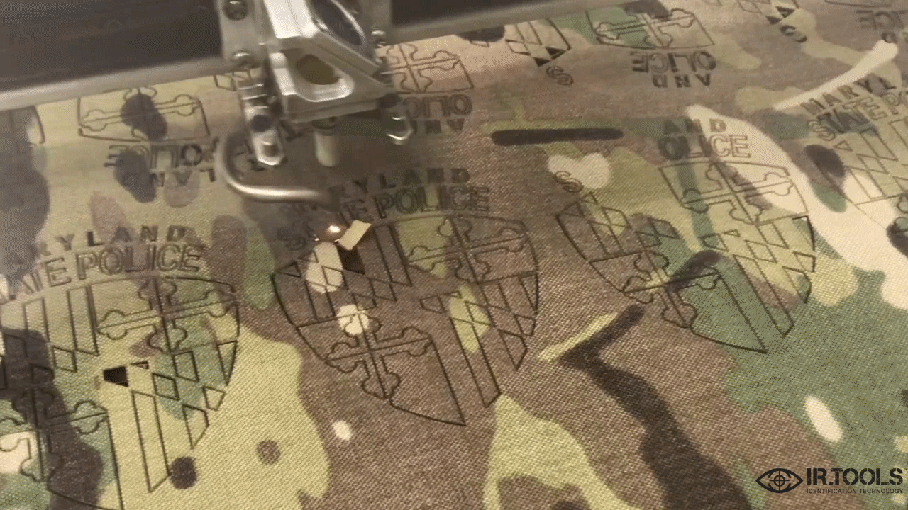 Laser machine cutting a Custom IR patch for MD State Police 