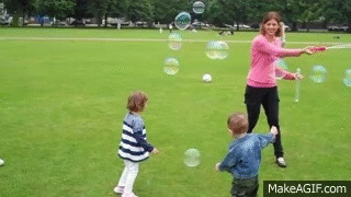 Kids Playing with Bubbles in the Park on Make a GIF