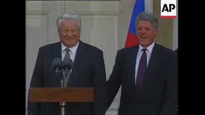 Bill Clinton and Boris Yeltsin laughing together