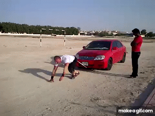 strong man training car pull on Make a GIF