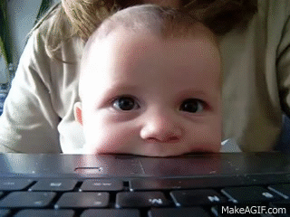 Cute baby eats laptop on Make a GIF