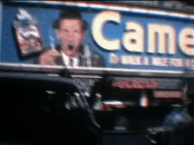 The Smoking Camel Man New York 1964 on Make a GIF