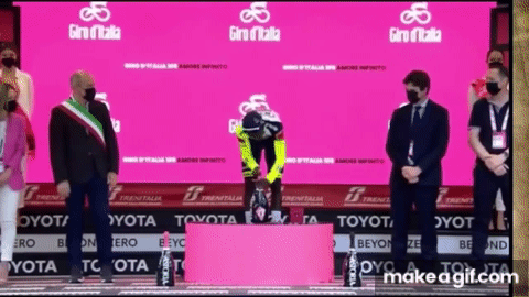 Biniam giray gets a prosecco cork in the eye | giro d italia 2022 on Make a GIF