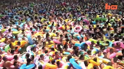 Thousands Of Swimmers Crowd In A Salty Swimming Pool In China on Make a GIF