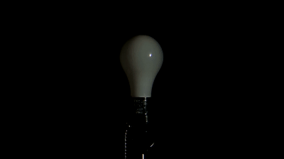 Light Bulb Turning on Against a Black Background, HD Stock Footage on Make  a GIF