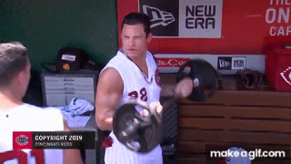 Derek Dietrich pumps iron in sleeveless Reds throwback unis 