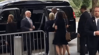 New angle of Hillary Clinton collapsing, plus something falls out of her  pant leg? on Make a GIF