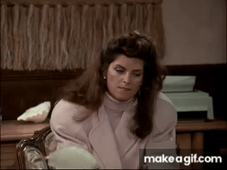 Kirstie Alley in cheers hiding a cigaret in her mouth on Make a GIF